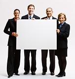 Business people holding blank paper