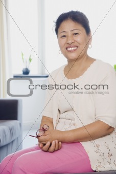 Woman Sitting in Living Room