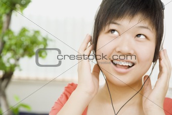 Smiling Woman Listening to Headphones