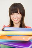 Young Woman Holding Colorful Notebooks