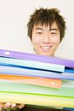 Young Man Holding Colorful Notebooks