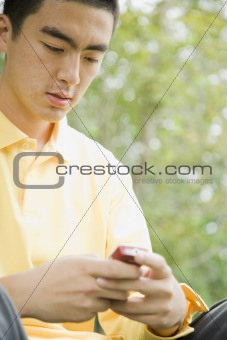 Young Man Outdoors With Cell Phone