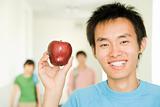 Young Asian Guy With Apple