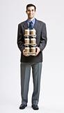 Businessman carrying stack of coffee cups