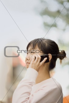 Young Woman Outdoors With Cell Phone
