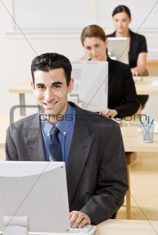 Business people typing on computer