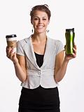 Businesswoman holding coffee cups