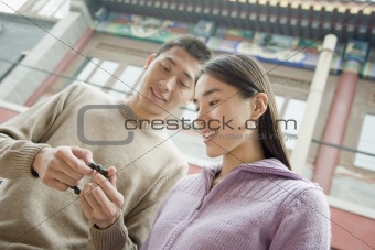 Couple Looking at Bracelet