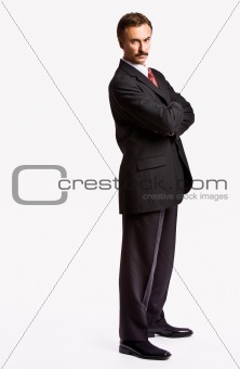 Stern businessman with arms crossed