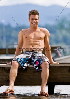Man sitting on pier