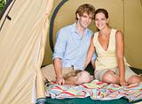 Couple sitting in tent