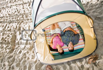 Couple laying in tent