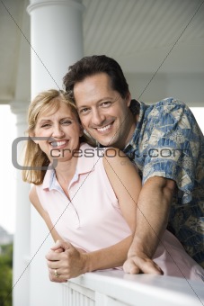 Happy Couple on Porch of Home