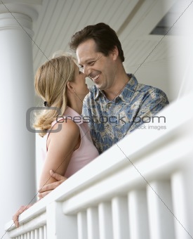 Happy Couple on Porch of Home
