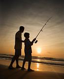 Man and young boy fishing in surf
Man and young boy fishing in surf
Man and young boy fishing in surf