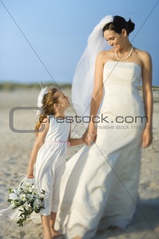 Bride and Flower Girl on Beach
