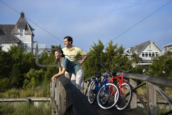 Couple on Bridge with Bicycles