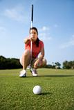 Female Golfer Concentrating