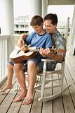 Father and Son Playing Guitar