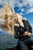 Young Woman Tossing Blond Hair
