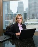 Smiling Businesswoman with Laptop