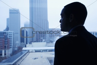 Businessman Looking Through a Window