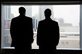 Businesspeople Looking Out of a Window