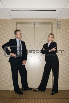 Businesspeople Waiting For Elevator