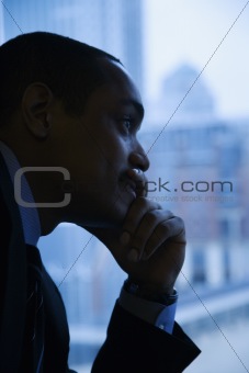 Pensive Businessman By Window