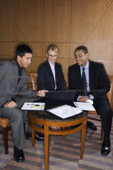 Businesspeople Looking at Laptop