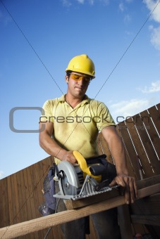Construction Worker Cutting Wood