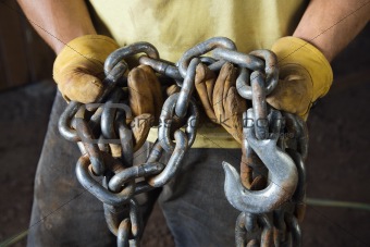 Gloved Hands Holding a Chain