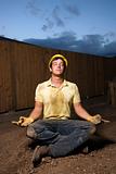 Meditating Construction Worker