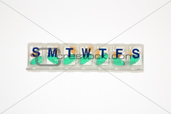 Pills in Closed Pill Organizer. Isolated