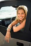 Smiling Woman Sitting in Car