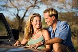 Couple With Map on Car Hood