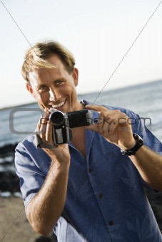 Smiling Man With Video Camera