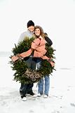 Young Couple Hugging with Wreath