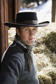 Attractive Young Man Wearing a Black Cowboy Hat