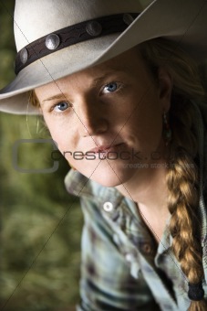 Attractive Young Woman Wearing a Cowboy Hat