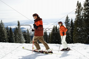 Couple Skiing on Mountain Slope