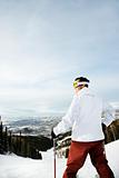 Skier on Mountain Overlooking Valley