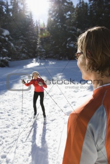 Man and Woman Snow Skiing