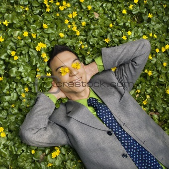 Smiling Businessman in Flower Patch