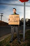 Businessman Holding Gas Money Sign