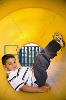 Young Boy Lying in Crawl Tube