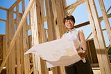 Woman Holding Building Plans