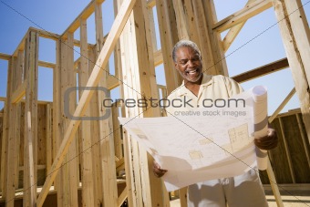 Man Holding Building Plans
