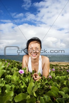 Woman Lying in Plants Near Beach