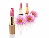 New lipstick on cosmetics and flower  background